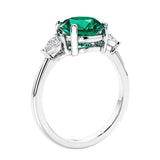 3 stone wedding ring featuring round emerald center diamond and matching sides set in 14k white gold.