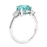 3 stone wedding ring featuring round paraiba green tourmaline center diamond and matching sides set in 14k white gold.