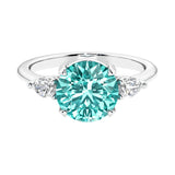 3 stone paraiba green tourmaline and diamond engagement ring with round center, symbolizing past, present, and future, set in 14k white gold.