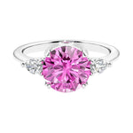3 stone pink sapphire and diamond engagement ring with round center, symbolizing past, present, and future, set in 14k white gold.