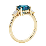 3 stone round diamond ring in classic yellow gold setting.