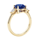 3 stone round diamond ring in classic yellow gold setting.
