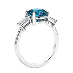 Round diamond engagement ring with side stones, ideal for those wanting affordable engagement rings that shine.