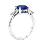 Round diamond engagement ring with side stones, ideal for those wanting affordable engagement rings that shine.