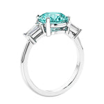 Round diamond engagement ring with side stones, ideal for those wanting affordable engagement rings that shine.