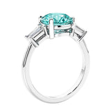Round diamond engagement ring with side stones, ideal for those wanting affordable engagement rings that shine.