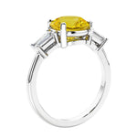 Round diamond engagement ring with side stones, ideal for those wanting affordable engagement rings that shine.