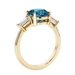 Round cut diamond ring in a 3 stone setting, one of our most loved female engagement rings.