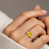 Woman wearing handcrafted round center gemstone engagement ring with sparkling diamond sides.
