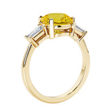 Round cut diamond ring in a 3 stone setting, one of our most loved female engagement rings.