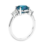 Round 3 stone engagement ring in white gold—a refined and popular choice among lab grown engagement rings.