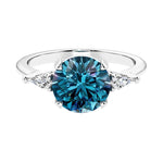 Custom round cut 3 stone engagement ring in 14k gold, perfect for modern brides.