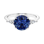 Custom blue sapphire round cut 3 stone engagement ring in 14k gold, perfect for modern brides.