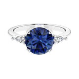 Custom blue sapphire round cut 3 stone engagement ring in 14k gold, perfect for modern brides.
