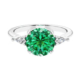 Custom colombian emerald round cut 3 stone engagement ring in 14k gold, perfect for modern brides.