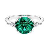 Custom emerald round cut 3 stone engagement ring in 14k gold, perfect for modern brides.