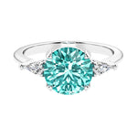 Custom paraiba tourmaline round cut 3 stone engagement ring in 14k gold, perfect for modern brides.