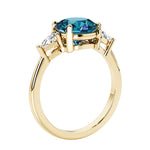 Lab diamond engagement ring with round gemstone center and two sparkling diamond side stones for timeless beauty.