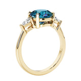 Lab diamond engagement ring with round gemstone center and two sparkling diamond side stones for timeless beauty.