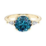 Handcrafted round center gemstone engagement ring with sparkling diamond sides.