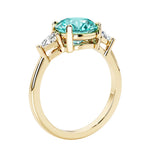 Lab diamond engagement ring with round paraiba tourmaline center and two sparkling diamond side stones for timeless beauty.