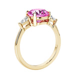 Lab diamond engagement ring with round pink diamond lookalike pink sapphire center and two sparkling diamond side stones for timeless beauty.