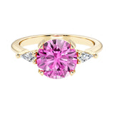 Handcrafted round center pink diamond lookalike pink sapphire engagement ring with sparkling diamond sides.