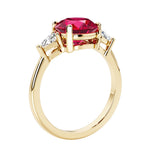 Lab diamond engagement ring with round red ruby center and two sparkling diamond side stones for timeless beauty.