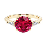 Handcrafted round center red ruby engagement ring with sparkling diamond sides.