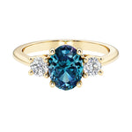 Oval 3 stone engagement ring with real alexandrite and brilliant diamond side stones.