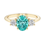 Oval 3 stone engagement ring with paraiba tourmaline and brilliant diamond side stones.