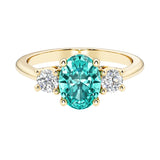 Oval 3 stone engagement ring with paraiba tourmaline and brilliant diamond side stones.