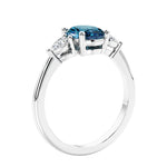 Oval cut three stone real alexandrite and diamond engagement ring with romantic charm.