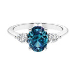 Three stone oval and pear shaped real alexandrite and diamond ring in classic design.