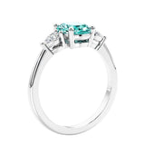 Oval cut three stone real paraiba green tourmaline and diamond engagement ring with romantic charm.