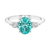 Three stone oval and pear shaped real paraiba green tourmaline and diamond ring in classic design.