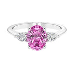 Three stone oval and pear shaped real pink sapphire, a pink diamond ring alternative, and diamond ring in classic design.