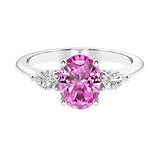 Three stone oval and pear shaped real pink sapphire, a pink diamond ring alternative, and diamond ring in classic design.