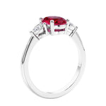Oval cut three stone real red ruby and diamond engagement ring with romantic charm.