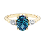 Oval and pear shape 3 stone engagement ring with color changing alexandrite and brilliant diamond side stones.