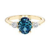 Oval and pear shape 3 stone engagement ring with color changing alexandrite and brilliant diamond side stones.