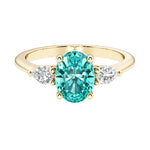 Oval and pear shape 3 stone engagement ring with paraiba tourmaline and brilliant diamond side stones.