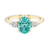 Oval and pear shape 3 stone engagement ring with paraiba tourmaline and brilliant diamond side stones.