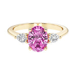 Oval and pear shape 3 stone engagement ring with pink sapphire and brilliant diamond side stones.