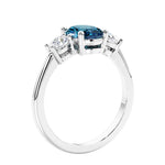 Unique engagement ring with oval gemstone and brilliant diamonds