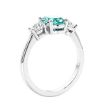 Unique engagement ring with oval gemstone and brilliant diamonds