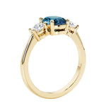 3 stone oval engagement ring with elegant proportions with alexandrite gemstone and diamond side stones.