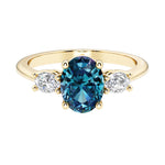 Oval 3 stone engagement ring with real alexandrite and brilliant diamond side stones.