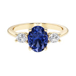 Oval 3 stone engagement ring with real blue sapphire and brilliant diamond side stones.