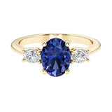 Oval 3 stone engagement ring with real blue sapphire and brilliant diamond side stones.